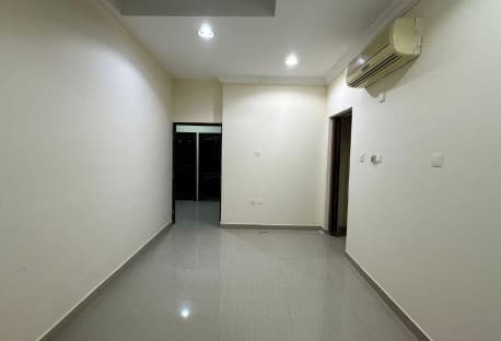 A room and a lounge with a kitchen and a comprehen
