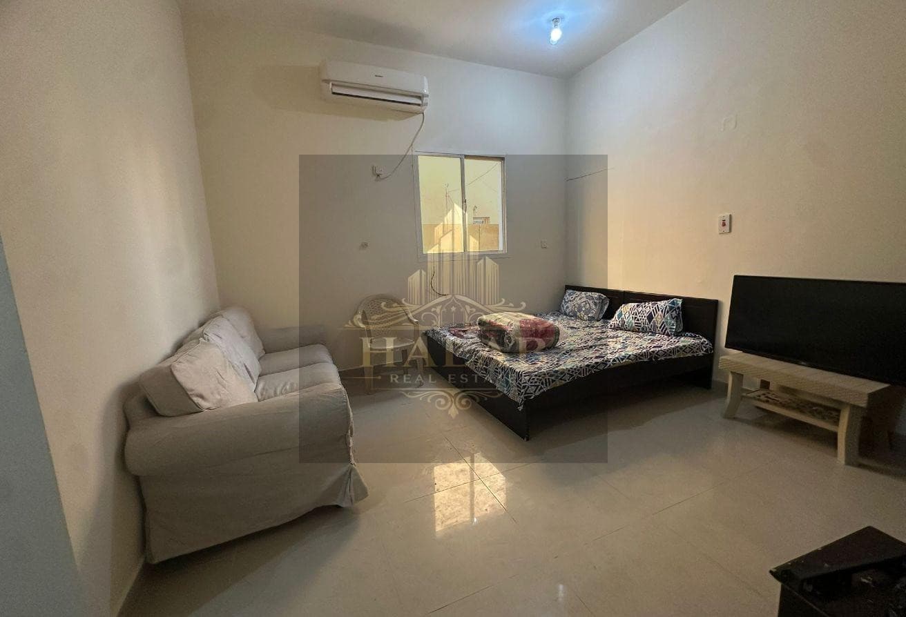 A room with a kitchen and a comprehensive bathroom